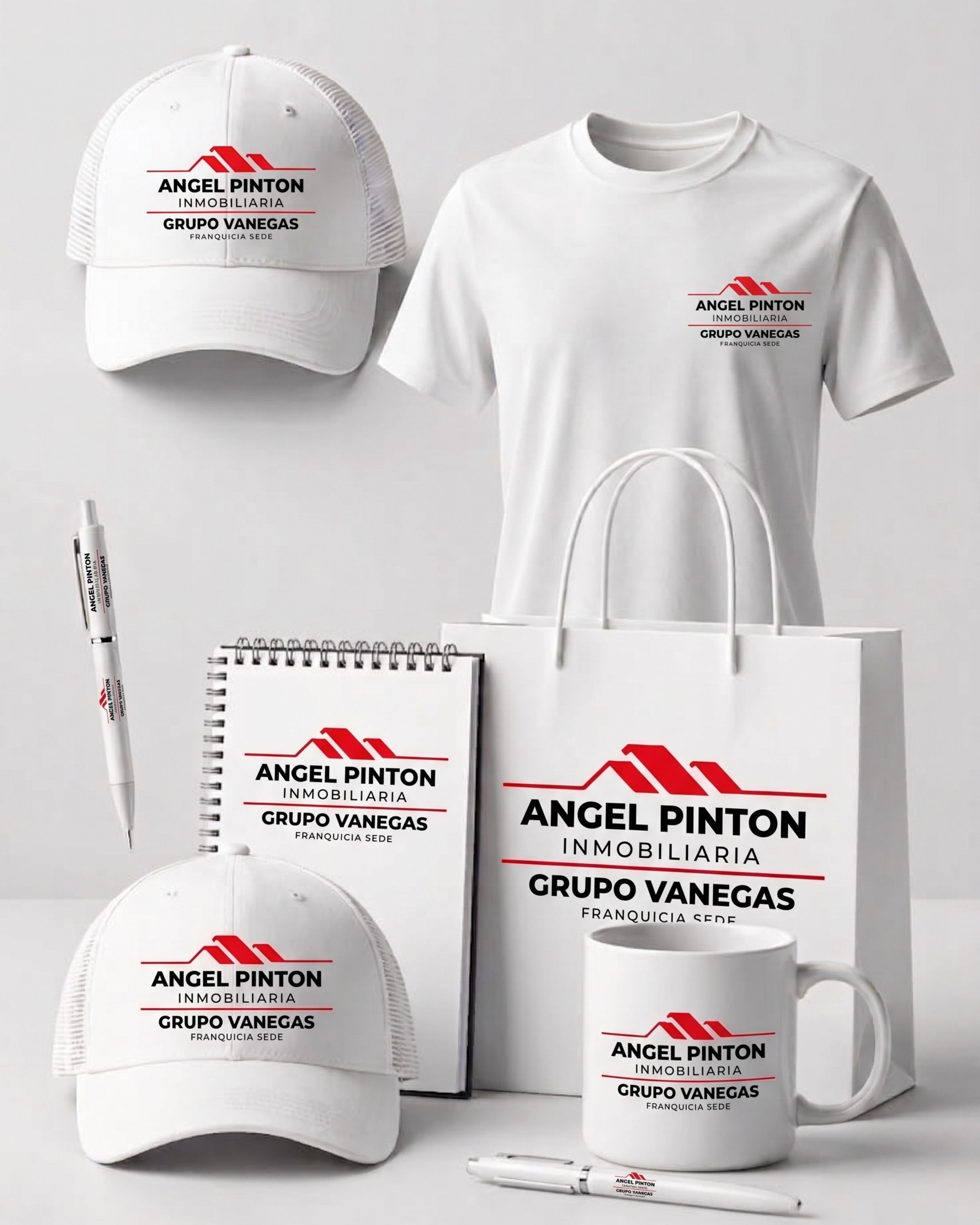 Artículos promocionales de marca — gorras, camisetas, tazas, libretas y bolsas con el logo de Angel Pintón · Grupo Vanegas